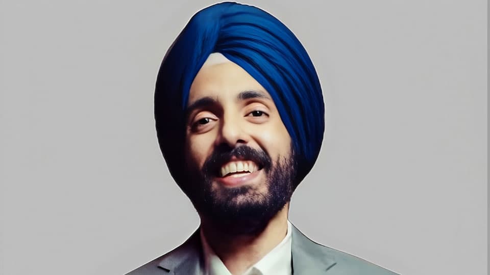 A headshot of Brijinder Anand. He is smiling at the camera.